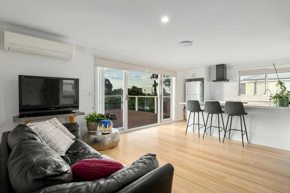 A living room filled with furniture and a flat screen TV